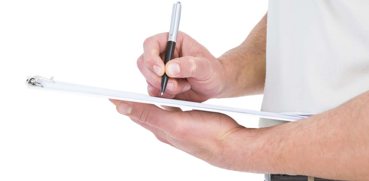 Technician writing cost of AC and Heater repair on clipboard over white background