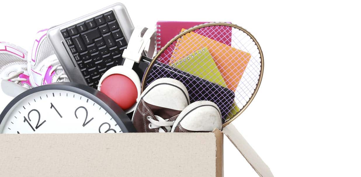 Cardboard box full of stuff ready for Moving Day isolated on white background